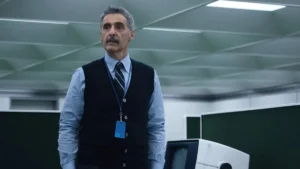 John Turturro complains, but deep down he enjoys the experience in 'Severance' (Credit: Apple TV+)