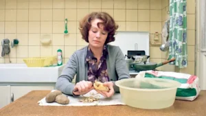 There is something powerful in seeing the protagonist peel potatoes in 'Jeanne Dielman' (Credit: Filmicca)